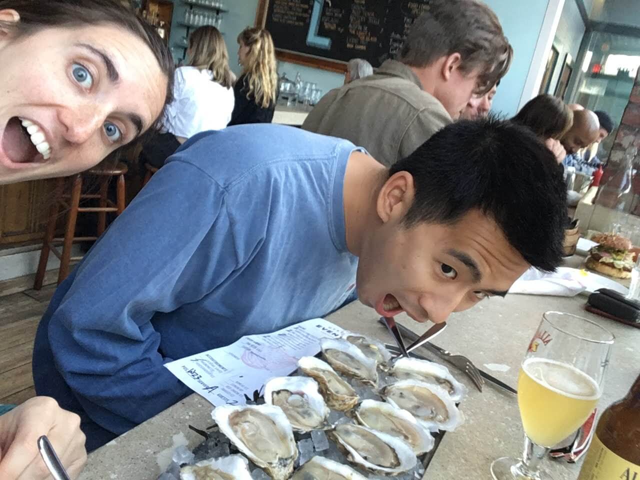 Meg and Keshane eating oysters